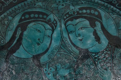 Lot 258 - A BLACK-PAINTED TURQUOISE-GLAZED SELJUK KASHAN-REVIVAL POTTERY DISH WITH COURTLY COUPLE