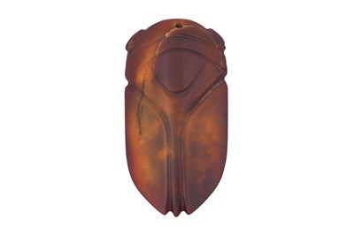 Lot 53 - A SMALL CHINESE RED JADE ARCHAISTIC CARVING OF A CICADA