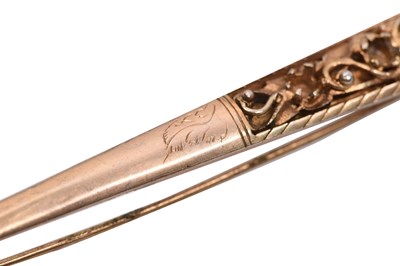 Lot 60 - A SRI LANKAN RUBY-SET PARCEL-GILT SILVER HAIRPIN (KONDAKOORA)