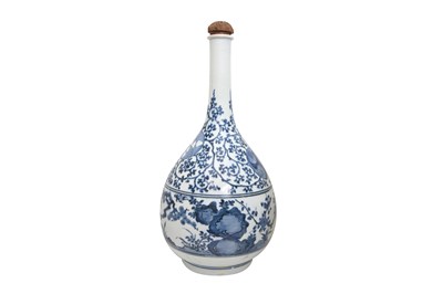 Lot 72 - A LARGE BLUE AND WHITE ARITA 'PRUNUS AND PINE' BOTTLE VASE